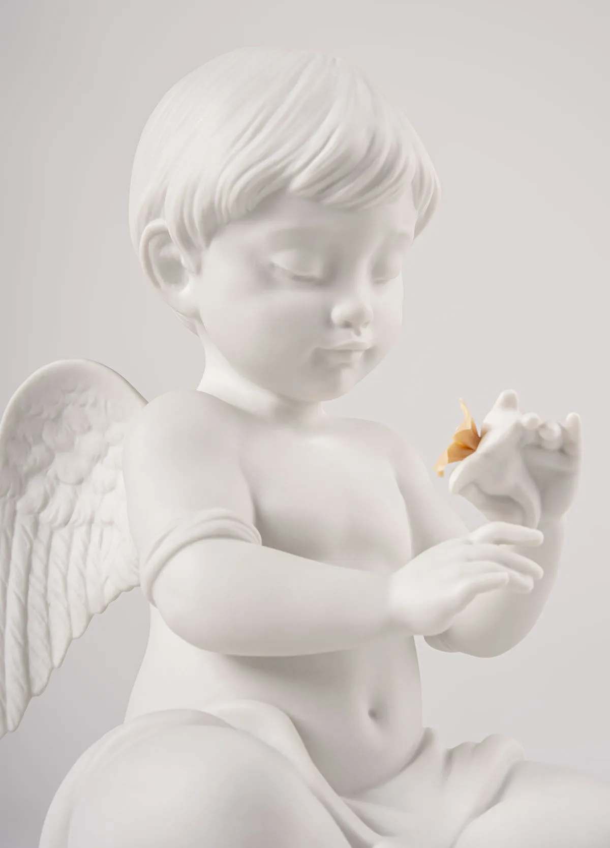 LLADRÓ Scultura Angelo con fiore